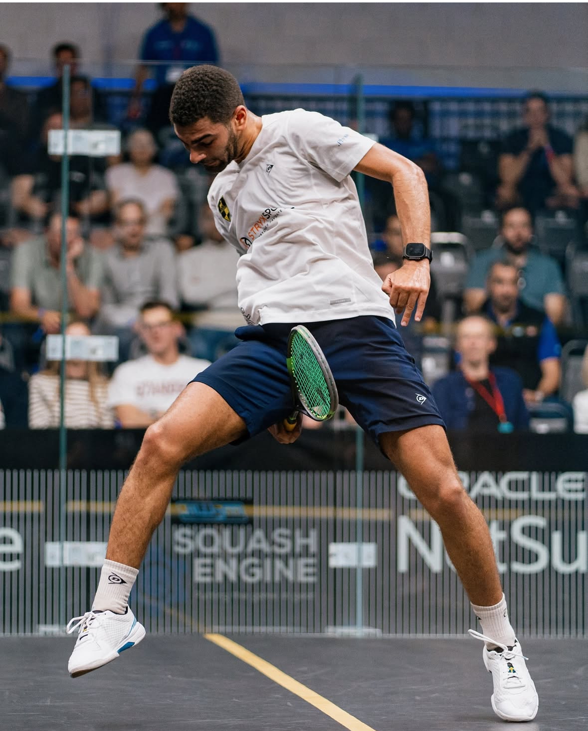Professional squash player demonstrating skill
